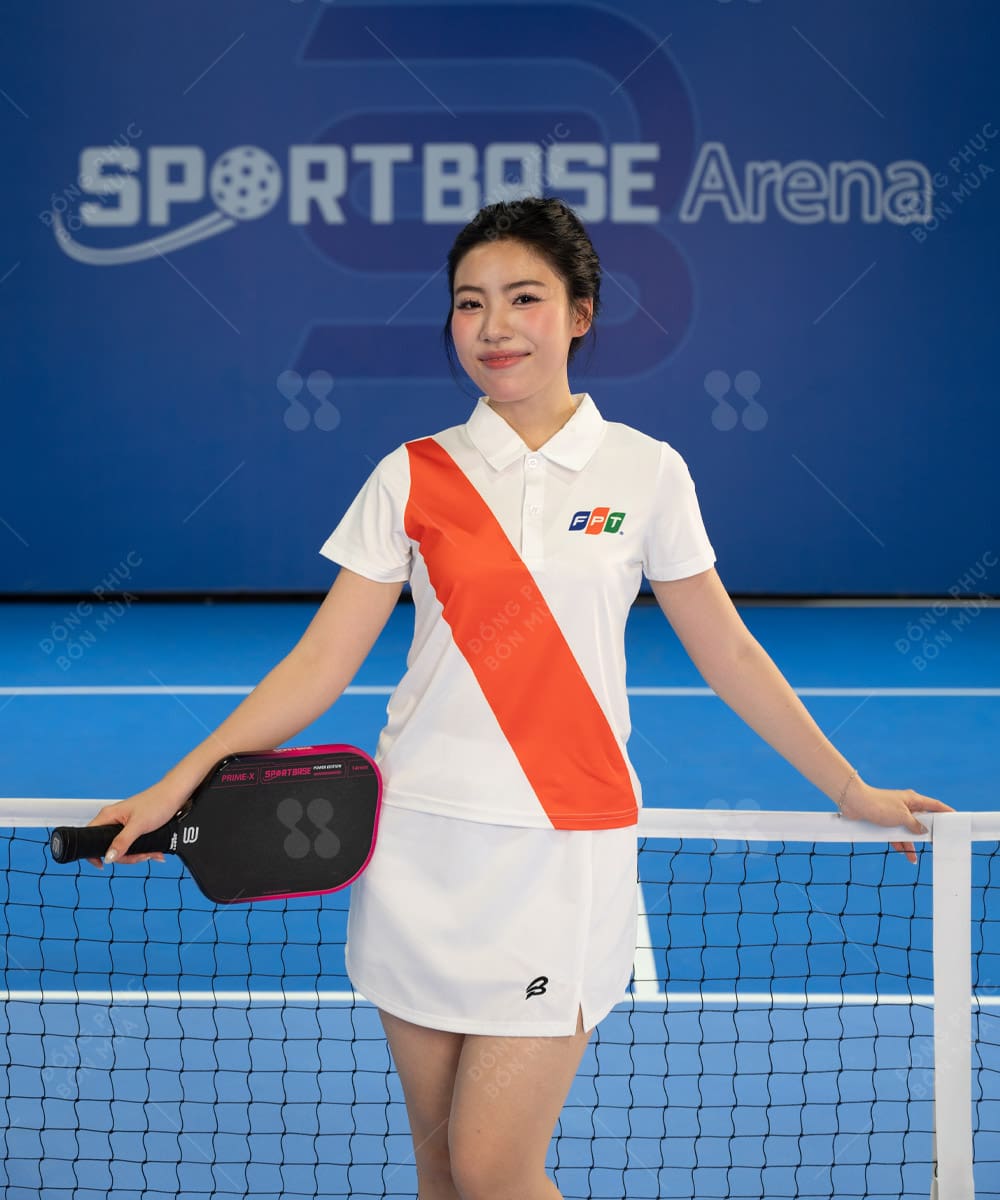 Mẫu áo pickleball trắng phối cam nổi bật